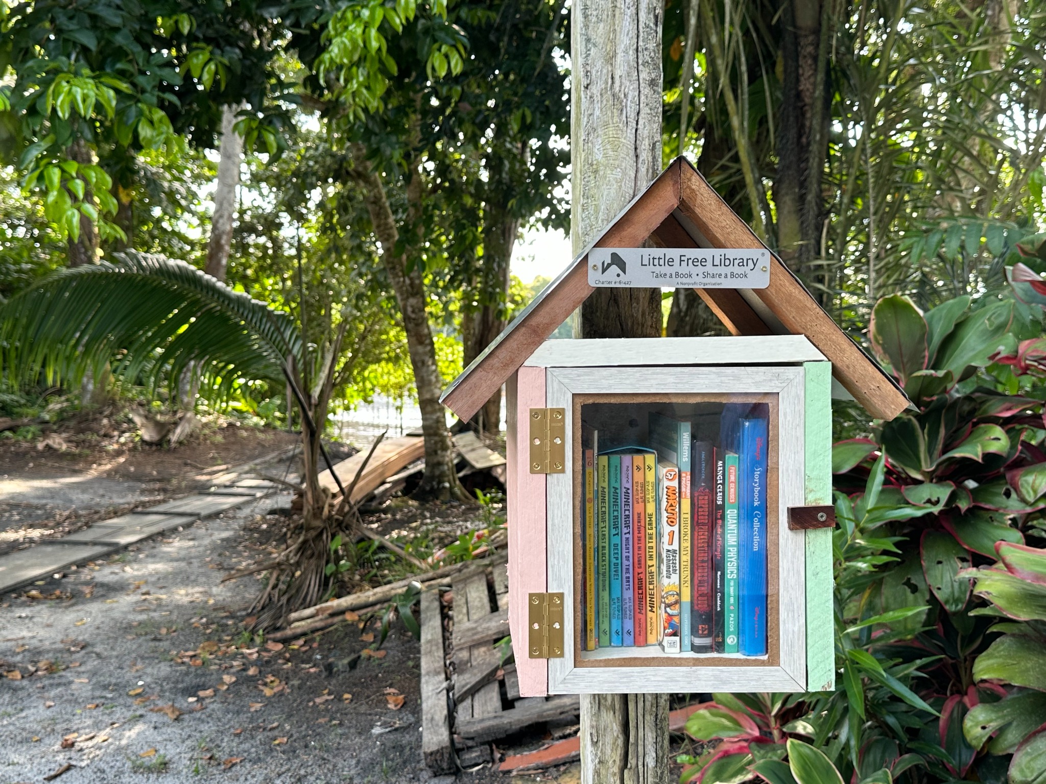 Dora River Landing Little Free Library with its door open